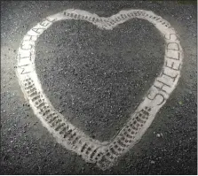  ?? MEDIANEWS GROUP ?? A concrete heart-shaped memorial was placed in August 2017on the spot where Michael Shields was killed on Aug. 6, 2016, at a garage on Benjamin Franklin Highway in Douglassvi­lle.