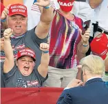  ??  ?? Right: A young supporter cheers him at a rally at The Villages Polo Field Airport