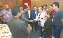  ??  ?? President Duterte greets MVP in Foshan, China. With them are Executive Secretary Salvador Medialdea, Senators Francis Tolentino, Ronald dela Rosa and Bong Go, the author, Cavite Rep. Strike Bautista Revilla and PLDT SVP and group controller and Smart CFO Chaye Cabal-Revilla.