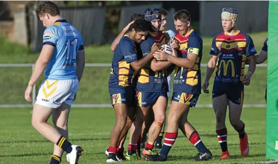  ??  ?? TRY TIME: The Western Mustangs celebrate a try by Jazz Namana (centre) against Norths at Gold Park. PHOTO: KEVIN FARMER