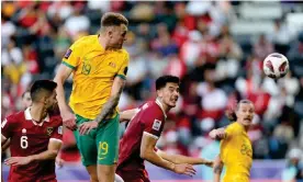  ?? ?? Harry Souttar heads home Australia’s final goal against Indonesia. Photograph: Hussein Sayed/AP