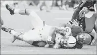  ?? Andrew Shurtleff/associated Press ?? Penn State’s Steven Bench is tackled by Virginia linebacker LaRoy Reynolds. Bench is the third quarterbac­k to play a game as a freshman at Penn State.