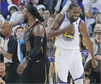  ?? TONY AVELAR/THE ASSOCIATED PRESS ?? Warriors forward Kevin Durant, right, blocked a key late shot by LeBron James and celebrated in front of Cleveland’s Jae Crowder during Golden State’s victory Monday in Oakland.