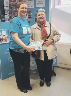  ??  ?? Hazel Wynn, winner of the Co-op cake raffle held in aid of Red Cross Tackle Loneliness Across the UK charity.