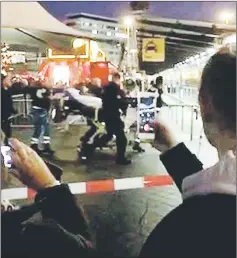 ??  ?? Paramedics carry the knifeman on stretchers at Amsterdam’s Schiphol Airport. — Reuters photos