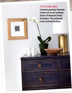  ??  ?? A STYLISH MIX Ceramic pots by Hannah James sit on an antique chest of drawers from Fontaine. The artwork is by Corinna Button