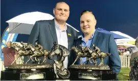  ??  ?? WINNING CAMPAIGN. Jason van der Bank (left) with all the stable trophies after Walter Smoothie won the Listed Racing Associatio­n Handicap over 3200m on Saturday for the Stuart Pettigrew yard. He enjoyed the moment with cousin Tyron Vermaak.
