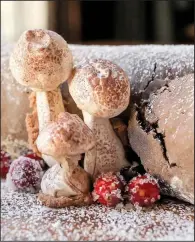  ?? Food styling/KELLY BRANT Arkansas Democrat-Gazette/JOHN SYKES JR. ?? Rubbing Meringue Mushrooms with cocoa powder gives them a natural appearance, while Sugared Cranberrie­s provide a pop of color.