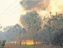  ??  ?? A fire rages in the Deepwater National Park, Queensland