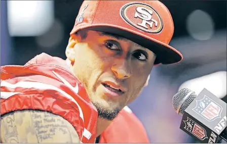  ?? — Photos by the Associated Press ?? In the photo above, San Francisco 49ers quarterbac­k Colin Kaepernick (7) answers reporters’ questions during Super Bowl media day activities on Tuesday in New Orleans. The qualities that have helped put Kaepernick in the NFL’s championsh­ip game are the...