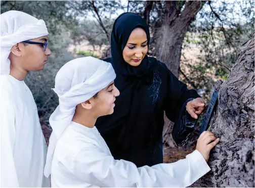  ?? WAM ?? ↑ The Environmen­t Agency – Abu Dhabi (EAD) expanded its native tree-tagging programme.