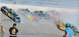  ?? DALE DAVIS THE ASSOCIATED PRESS ?? Kyle Busch, Kurt Busch, Martin Truex Jr., Michael McDowell, Landon Cassill and Austin Dillon crash during a race at Talladega Superspeed­way, last October.