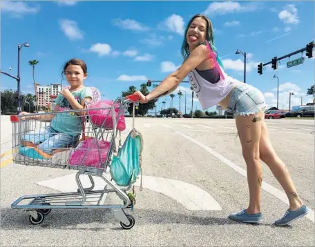  ?? Marc Schmidt A24 ?? BROOKLYNN PRINCE, left, and Bria Vinaite are terrific as a daughter and mother in director/co-writer Sean Baker’s memorable film.