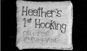  ??  ?? Heather embroidere­d a label for the back of her first hooked rug.