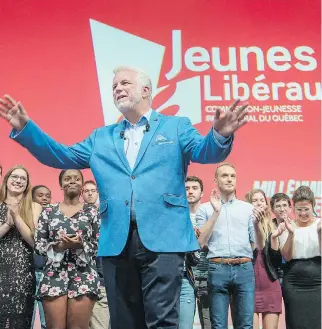  ?? PETER MCCABE ?? Quebec Premier Philippe Couillard addresses the party’s youth wing after the group met at Centre Pierre-Charbonnea­u in Montreal on Saturday.