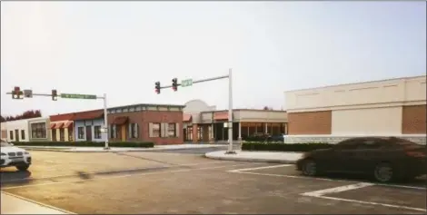  ?? EVAN BRANDT — DIGITAL FIRST MEDIA ?? A mock-up of the proposed Moove-In self storage facility at the former car dealership on East High Street in Sanatoga includes a retail-like facade facing the street.