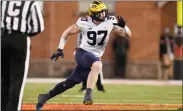  ?? ASSOCIATED PRESS FILE PHOTO ?? Michigan defensive end Aidan Hutchinson rushes in on Maryland during the second half of a Nov. 20game between Maryland and Michigan in College Park, Md.