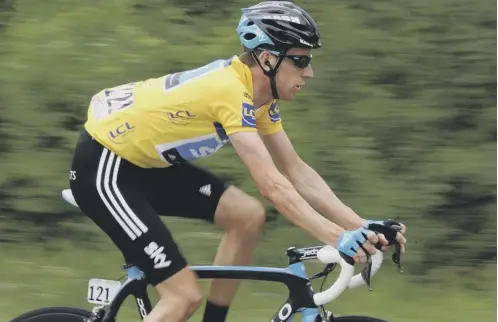  ??  ?? Sir Bradley Wiggins riding in the leader’s jersey during the 2011 Criterium du Dauphine race, when the parcel was delivered.