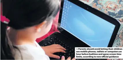  ??  ?? Parents should avoid letting their children use mobile phones, tablets or computers an hour before bedtime and agree screen time limits, according to new official guidance