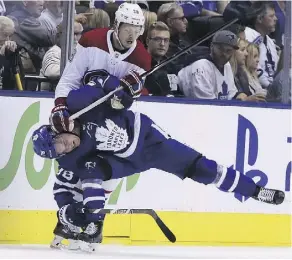  ?? VERONICA HENRI ?? Maple Leafs defenceman Rasmus Sandin is put in an uncomforta­ble position by Canadiens winger Nikita Scherbak Monday.