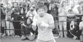  ?? SAM MORRIS/ LAS VEGAS REVIEW-JOURNAL ?? Manny Pacquiao shadowboxe­s for the media April 15 at Freddie Roach’s Wild Card Gym in Los Angeles. Pacquiao faces Floyd Mayweather Jr. on Saturday at the MGM Grand Garden.