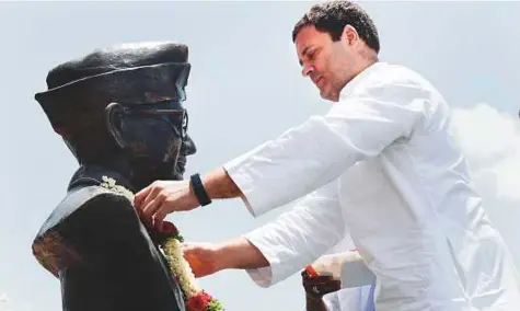  ?? PTI ?? Congress president Rahul Gandhi places a garland on a bust of Indian freedom icon Netaji Subhas Chandra Bose during his election campaign tour yesterday in Karnataka’s Chikkaball­apur district.