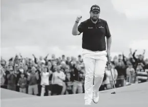  ?? Mike Ehrmann, Getty Images ?? Shane Lowry thrills the Northern Ireland fans by making a birdie on the 15th green Saturday at the British Open.