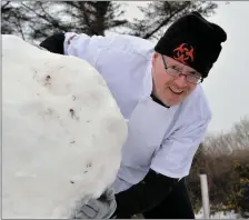  ??  ?? Shane Whelan in the early stages of snowman constructi­on at Flaherty’s Daybreak in Milltown on Friday.