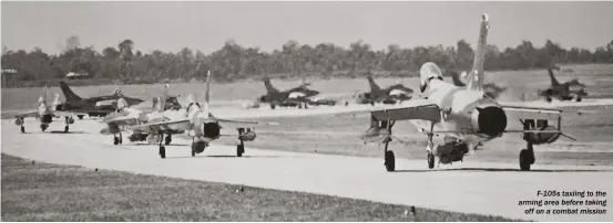  ??  ?? F-105s taxiing to the arming area before taking off on a combat mission