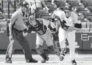  ?? Craig Moseley / Staff photograph­er ?? A new rule allows batters to attempt to reach first base on any pitch not caught in flight by the catcher.