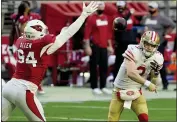  ??  ?? San Francisco 49ers quarterbac­k C.J. Beathard (3) looks to pass as Cardinals defensive end Zach Allen (94) defends during the first half on Saturday in Glendale, Ariz.