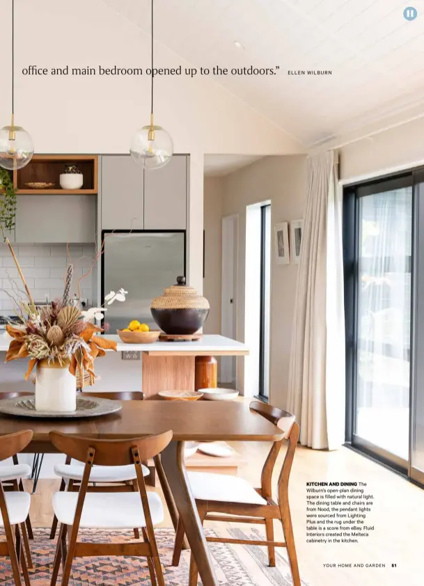  ??  ?? The Wilburn’s open-plan dining space is filled with natural light. The dining table and chairs are from Nood, the pendant lights were sourced from Lighting Plus and the rug under the table is a score from eBay. Fluid Interiors created the Melteca cabinetry in the kitchen.