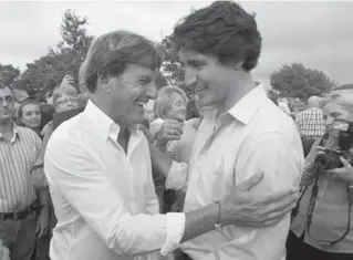  ?? ANDREW VAUGHAN/THE CANADIAN PRESS ?? When it comes to modern methods of voter persuasion, Liberal Leader Justin Trudeau, right, and party fundraiser Stephen Bronfman are taking a page from American political organizers.