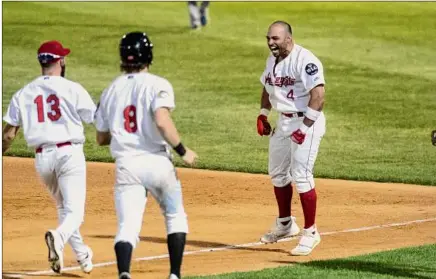  ?? James Franco / Special to the Times Union ?? Tri-city Valleycats second baseman Luis Roman celebrates after hitting a single in the bottom of the ninth to beat the New York Boulders.