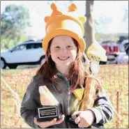  ?? JESI YOST — FOR MEDIANEWS GROUP ?? Clair Conklin, 8, daughter of Cafe 288’s Kate Conklin, wears the coveted Cheesetobe­rfest crown and holds the People’s Choice trophy and the Judge’s Choice award.