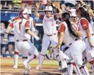  ?? BRYAN TERRY/ASSOCIATED PRESS ?? Rio Rancho High School graduate Nicole Pendley (1) celebrates with teammates after she hit a home run in Oklahoma’s win over Baylor Thursday.