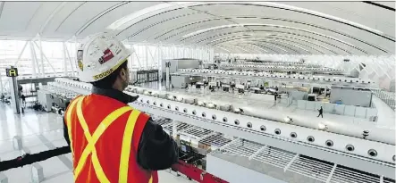  ?? TOBIN GRIMSHAW/CANADIAN PRESS ?? Aecon Constructi­on built Toronto Pearson Internatio­nal Airport’s Terminal 1 and many other projects across Canada. Ottawa is weighing a Chinese state owned company’s bid to take over the firm.