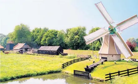  ?? CAMERON HEWITT/RICK STEVES’ EUROPE ?? In the Netherland­s, windmills helped reclaim land from the sea.