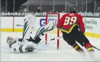  ?? JOHN LOCHER — THE ASSOCIATED PRESS ?? Sharks goaltender Devan Dubnyk (40) blocks a shot by Golden Knights right wing Alex Tuch (89) during the second period on Monday in Las Vegas.