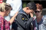  ??  ?? 4 Abdul Iskandar, a Malaysian Royal Navy sailor, who said he was supposed to be at Al Noor Mosque on the day of the shooting, is comforted as he weeps at the memorial site
