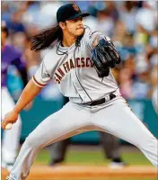  ?? JUSTIN EDMONDS / GETTY IMAGES ?? Giants reliever Dereck Rodriguez, whose father is Hall of Fame catcher Ivan Rodriguez, made his major league debut Tuesday against the Rockies.