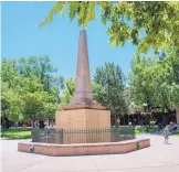  ?? T.S. LAST/JOURNAL ?? A plywood shell has been placed around the obelisk at the center of Santa Fe’s Plaza Park after it was vandalized twice in the last week.