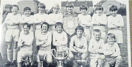  ?? ?? Craigie fan Nancy Gallcher sent us this photo of the successful footballer­s from St Clements Primary in Dundee’s Charleston district, back in season 1970-71. She says: “My son is in this picture and his dad was in the team that previously won the Rock Cup in 1939.”