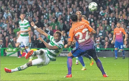  ??  ?? CITY BREAK: Moussa Dembele fires an acrobatic overhead kick into the bottom corner within seconds of the restart to put Celtic 3-2 in front.