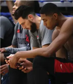  ?? CHAD HIPOLITO/THE CANADIAN PRESS ?? Andy Rautins, Bruno Caboclo and the Raptors can be excused if they need to check the time (or the date) more often than usual during this pre-season stretch.
