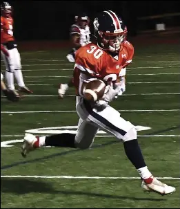  ?? Photos by Ernest A. Brown ?? Lincoln running backs Christian Petrone, above, and Tyler Durang, right, each rushed for over 200 yards to lead the Lions to a 41-12 victory over Central Falls/BVP Wednesday night at Ferguson Field.