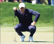  ?? John Raoux / Associated Press ?? Rory McIlroy lines up a putt on the eighth hole during the first round of the Arnold Palmer Invitation­al on Thursday.