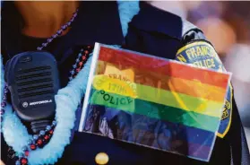  ?? Gabrielle Lurie / Special to The Chronicle 2016 ?? San Francisco police Officer Christine Magazines marches in the 2016 Pride parade. Officers won’t march this year because they can’t wear their uniforms.