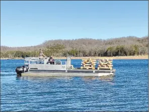  ?? (Courtesy photo/Arkansas Game and Fish) ?? Lumber fashioned into cribs was part of the fish habitat project.