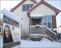  ?? PETER LEE, RECORD STAFF ?? A sold sign appears outside a house on Samuel Street in Kitchener on Friday. Sales in the second half of 2017 declined.